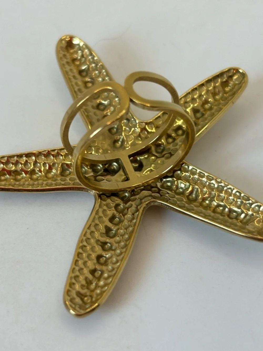 Ion plated gold starfish open back ring